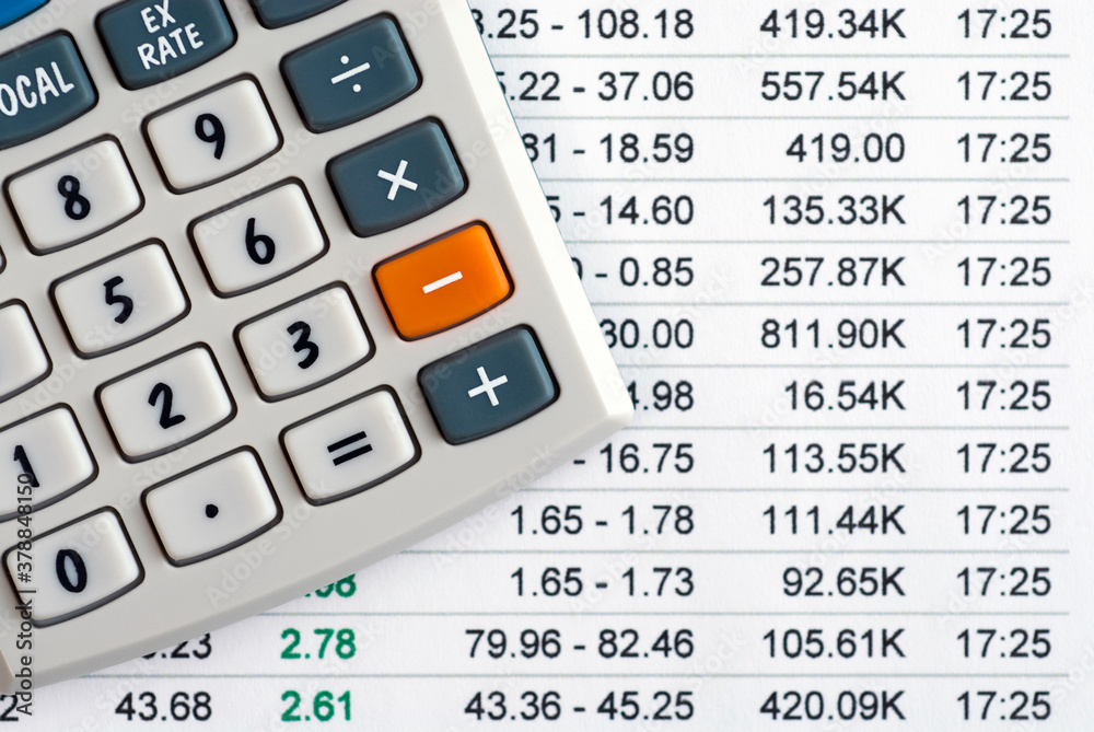 Close-up of a calculator on a financial report Close-up of a calculator on a financial report