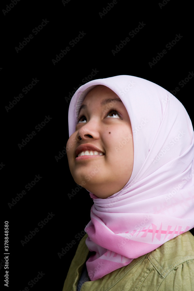 Indonesian teenager wearing headscarf smiling Indonesian teenager wearing headscarf smiling