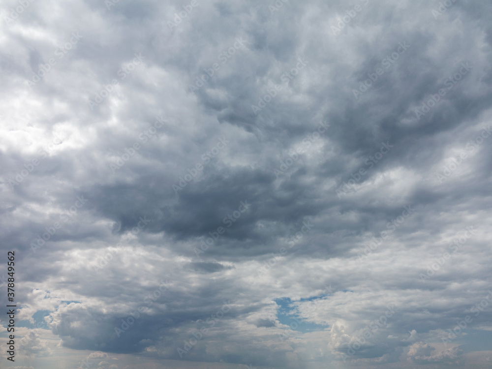 Divine sky. White fluffy clouds in the blue sky. Blue sky background with tiny clouds. Panorama Divine sky. White fluffy clouds in the blue sky. Blue sky background with tiny clouds. Panorama