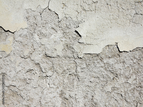 Abstract concrete, weathered with cracks and scratches. Remains of paint different colors on wall. Landscape style. Grunge Concrete Surface. Great background or texture.
