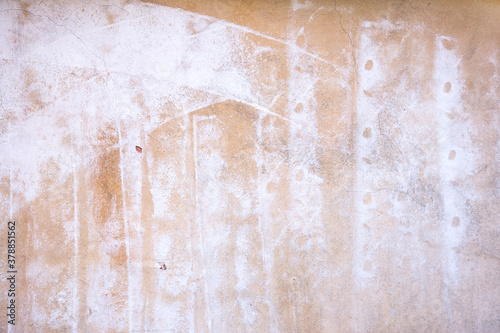 Abstract concrete, weathered with cracks and scratches. Remains of paint different colors on wall. Landscape style. Grunge Concrete Surface. Great background or texture.