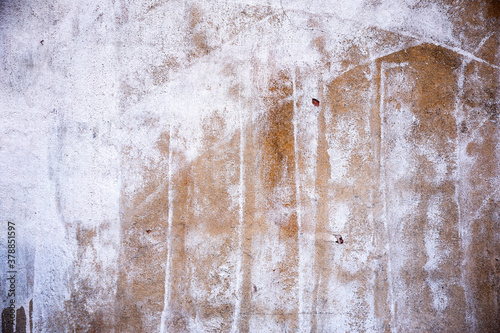 Abstract concrete, weathered with cracks and scratches. Remains of paint different colors on wall. Landscape style. Grunge Concrete Surface. Great background or texture.