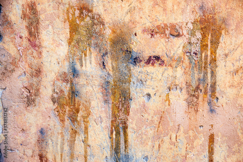 Abstract concrete, weathered with cracks and scratches. Remains of paint different colors on wall. Landscape style. Grunge Concrete Surface. Great background or texture.