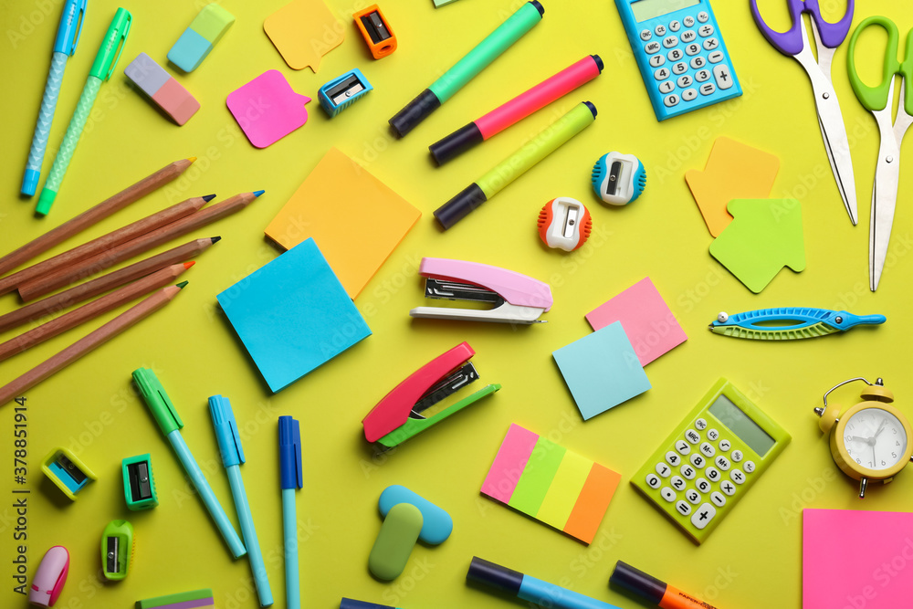 School stationery on yellow background, flat lay. Back to school