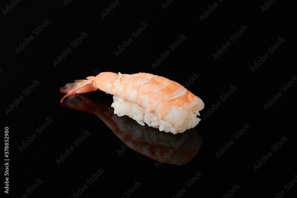 Sushi with tiger shrimp on a black background Sushi with tiger shrimp on a black background