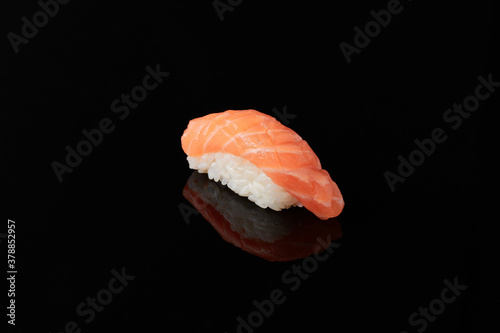 Sushi with salmon on a black background