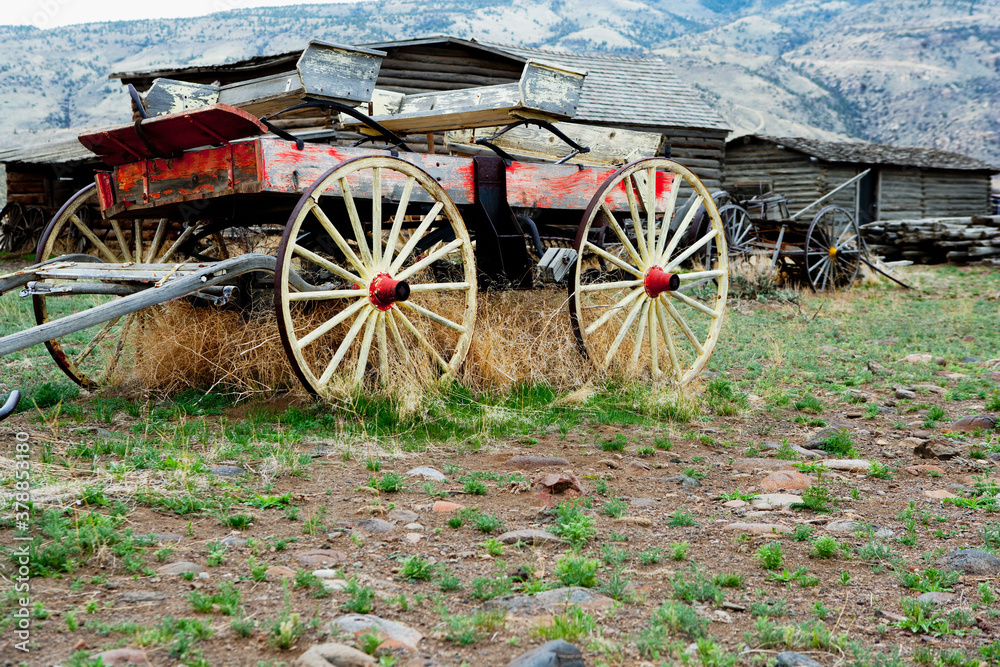 Wagon and abandoned houses in a ghost town, Old Trail Town, Cody, Wyoming, USA