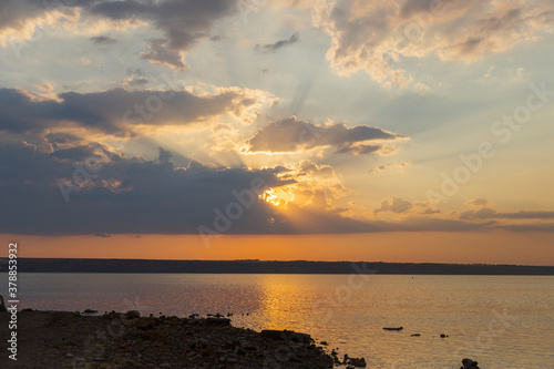 Beautiful twilight silhouette sunset on the Kuyalnik estuary near Odessa. Sunset over the lake. Evening sky with colorful cloud on twilight, Dusk