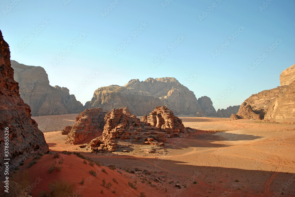 Scenery view of the Wadi Rum desert. Huge rocks, sand dune and the valley. Scenery view of the Wadi Rum desert. Huge rocks, sand dune and the valley.