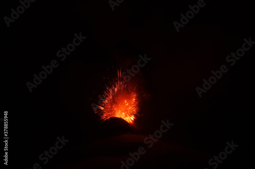 Volcano El Fuego erupts at night outside of Antigua Guatemala
