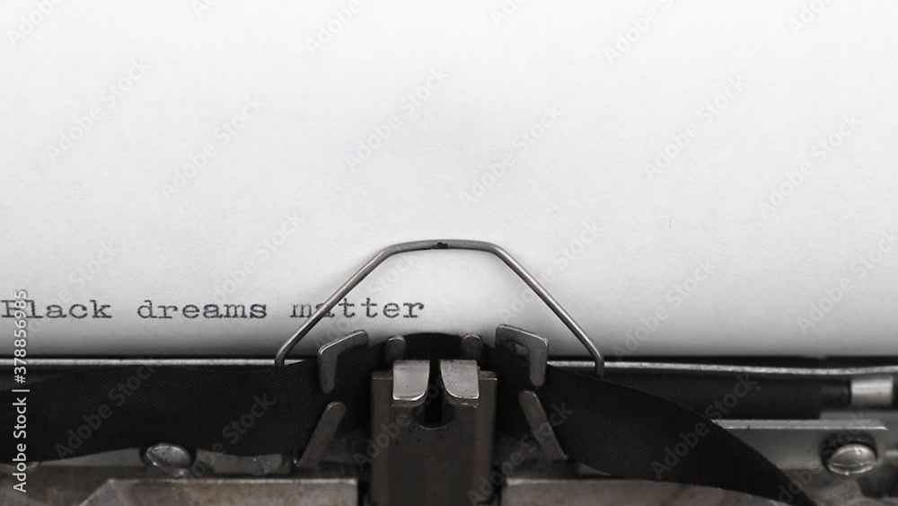 typing a quote black dreams matter on a vintage typewriter close-up typing a quote black dreams matter on a vintage typewriter close-up