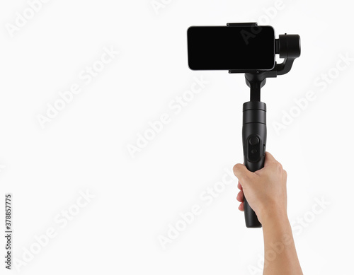 Photography Gimbal. Hand holding mobile phone stabilizer on white background