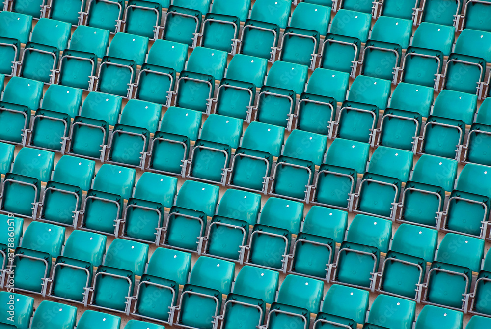 Naklejka premium High angle view of empty blue chairs in a stadium 