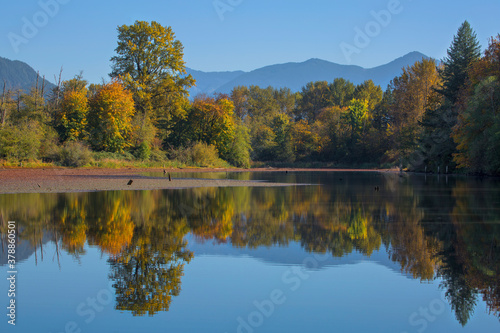 Beautiful autumn colors and reflections on Mill Pond in Snoqualmie, WA 
