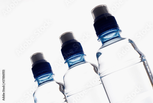 Close-up of three water bottles