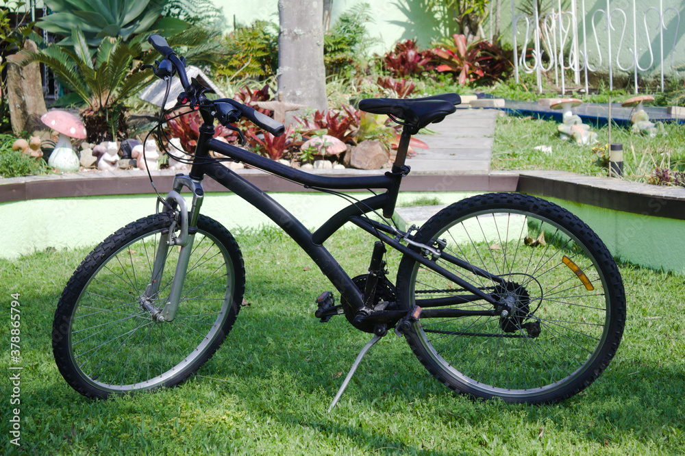 Cross bike parked on the garden grass