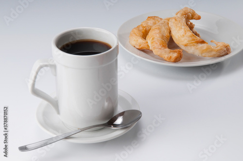 Danish croissants served with a cup of black coffee