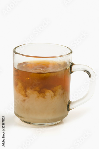 Close-up of a cup of tea on white background