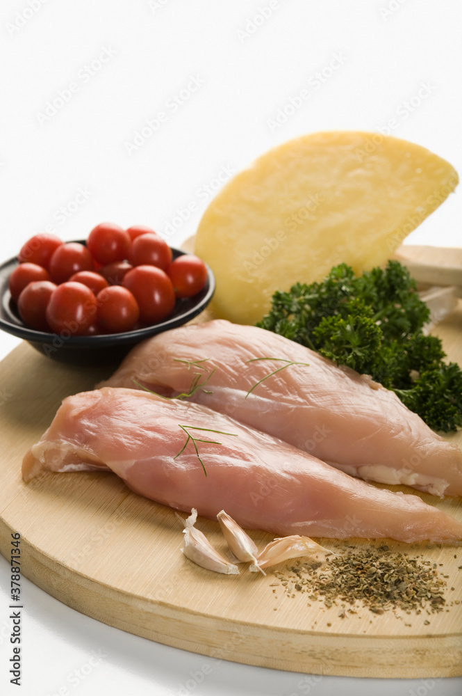 Close-up of raw chicken with ingredients Close-up of raw chicken with ingredients