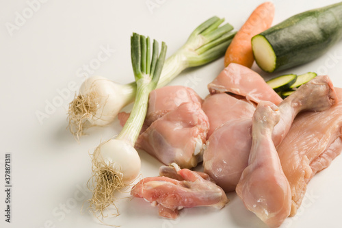 Close-up of raw chicken with vegetables