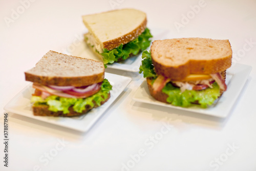 High angle view of three sandwiches