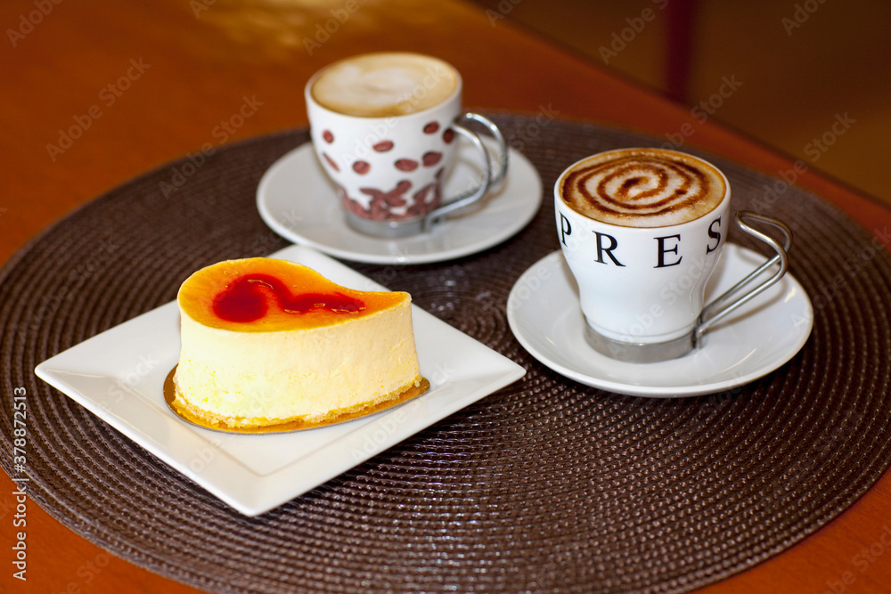 High angle view of two cups of coffee with mousse cake