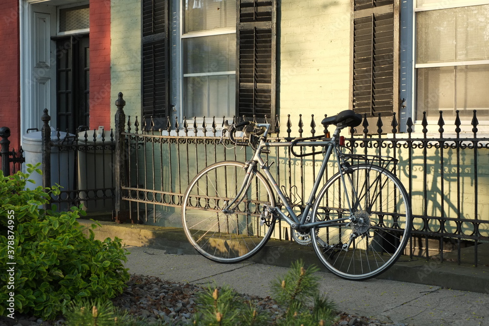 bicycle in front of brick house