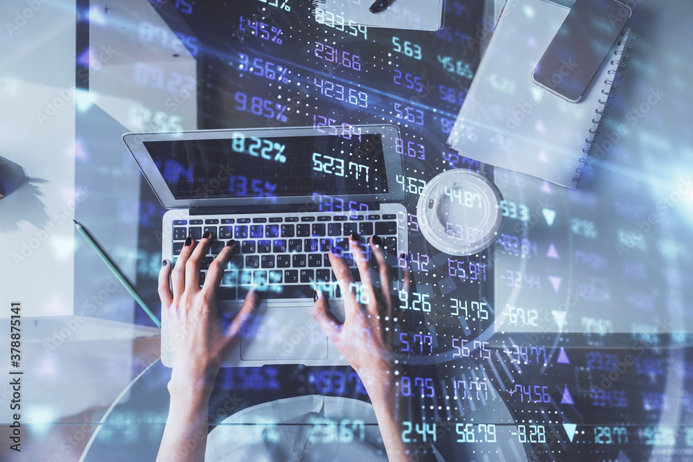 Double exposure of woman hands working on computer and forex chart hologram drawing. Top View. Financial analysis concept. Double exposure of woman hands working on computer and forex chart hologram drawing. Top View. Financial analysis concept.
