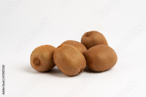 five kiwi fruit on white background