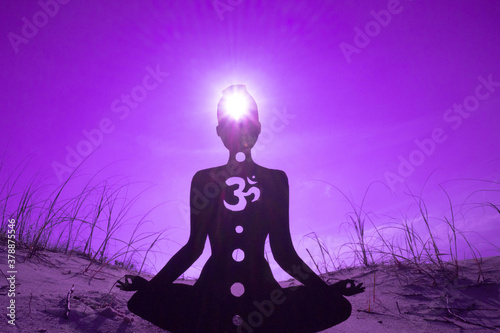 yoga position silhouette in contrasting sun, Crown chakra