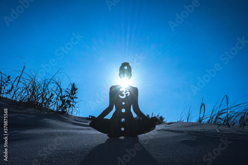yoga position silhouette in contrasting sun, Throat chakra