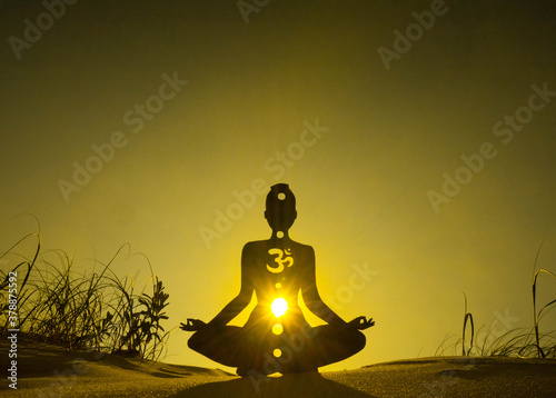 yoga position silhouette in contrasting sun, Solar Plexus chakra