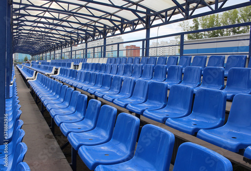 empty rows of seats at a sports stadium without visitors coronavirus