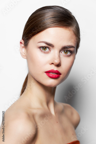 Elegant woman with red lips bared shoulders attractive look 