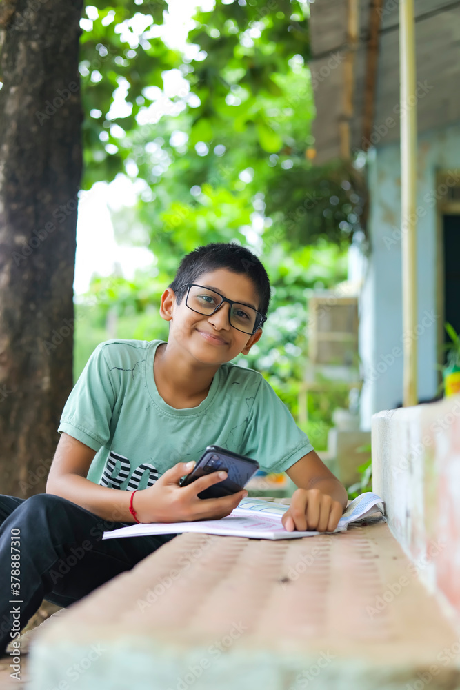 Fototapeta premium indian child attending online lecture