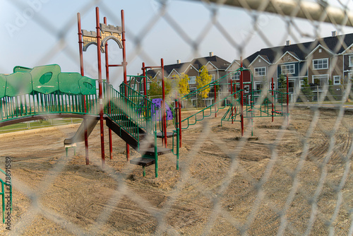 Childrend playground under construction behind a fence photo