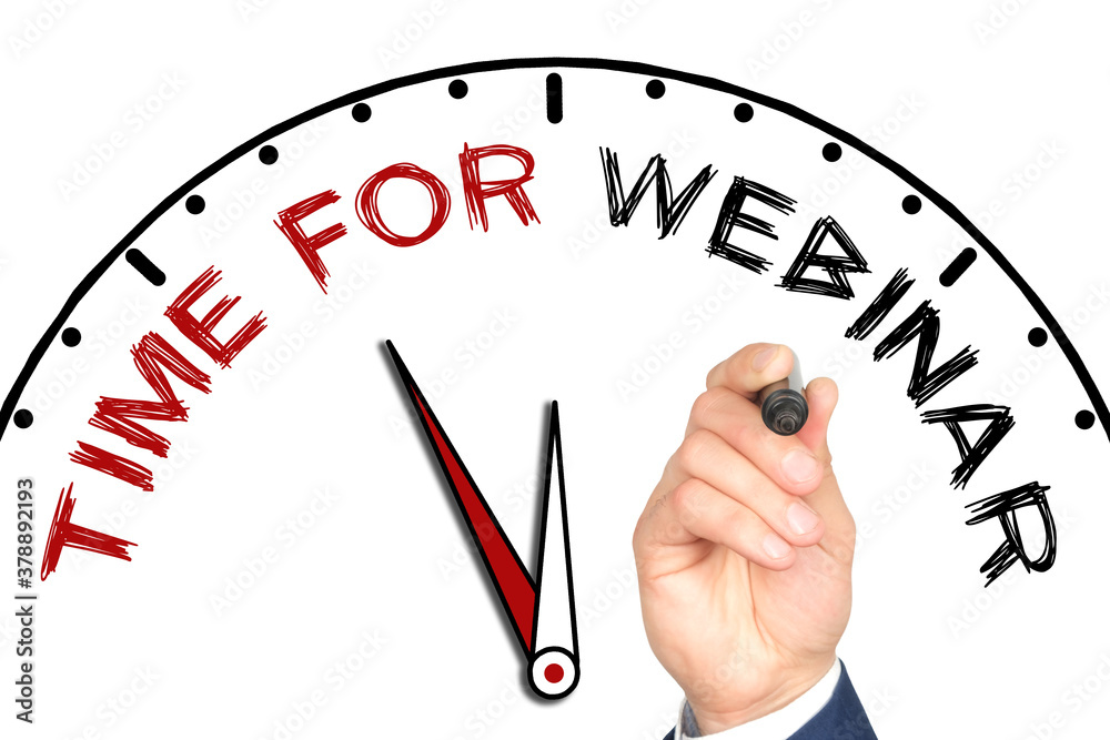 Hand writing TIME FOR WEBINAR on drawn clock with marker on transparent wipe board. Hand writing TIME FOR WEBINAR on drawn clock with marker on transparent wipe board.
