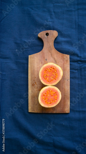 Red Guava on top Wooden base of a tray photo