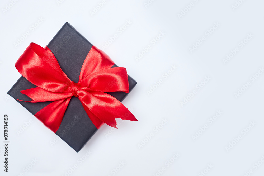 Black friday sale flat lay with gift box and ribbon, copy space, christmas and holidays concept on white background Black friday sale flat lay with gift box and ribbon, copy space, christmas and holidays concept on white background