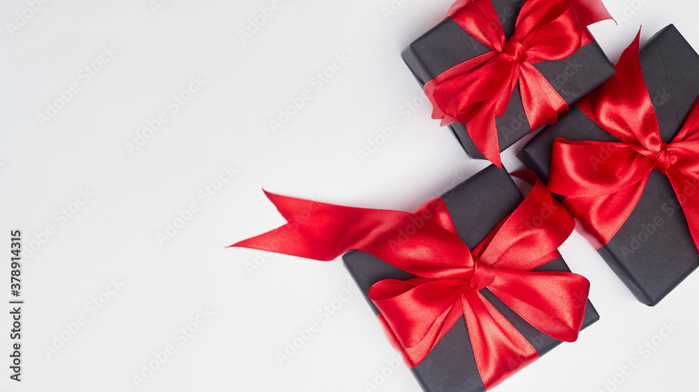 Black friday sale flat lay with gift box and ribbon, copy space, christmas and holidays concept on white background Black friday sale flat lay with gift box and ribbon, copy space, christmas and holidays concept on white background