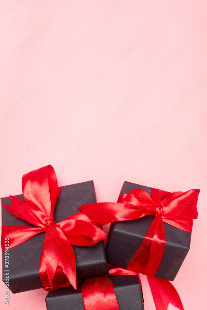 Black friday sale flat lay with gift box and ribbon, copy space, christmas and holidays concept on pink background Black friday sale flat lay with gift box and ribbon, copy space, christmas and holidays concept on pink background