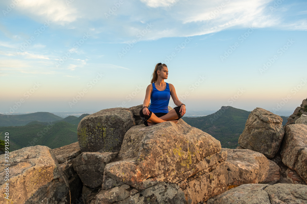 meditating girl on the mountain