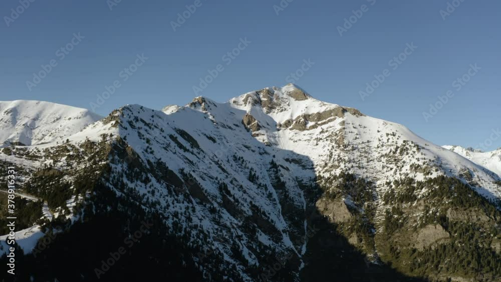 Aerial view of Snowy summit of a mountain range in Perynees, Andorra Aerial view of Snowy summit of a mountain range in Perynees, Andorra