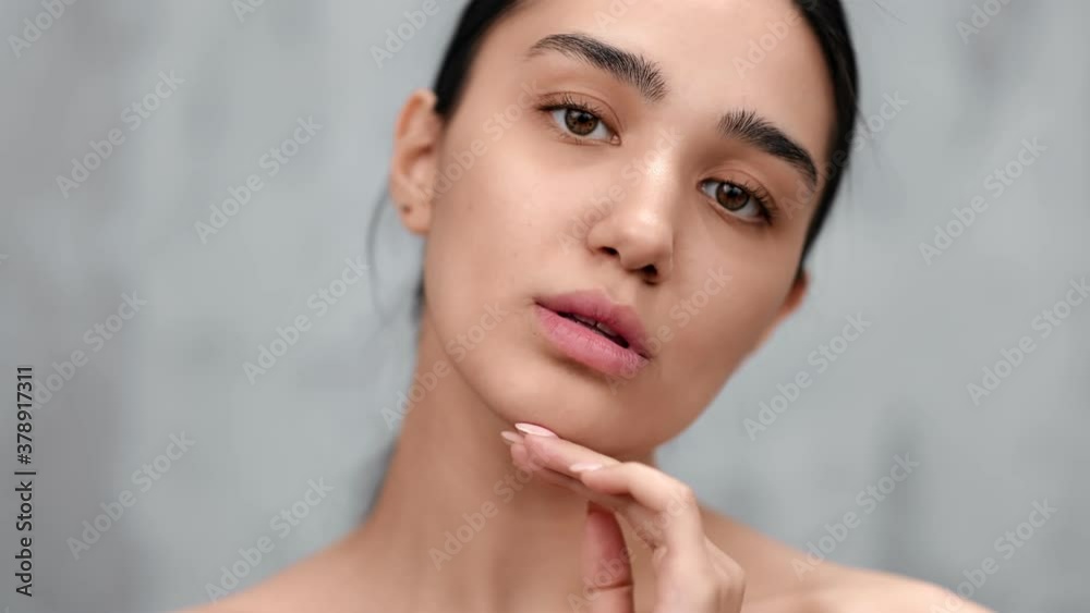 Portrait of Asian naked young woman with perfect pure skin posing. Close up shot on 4k RED camera Portrait of Asian naked young woman with perfect pure skin posing. Close up shot on 4k RED camera