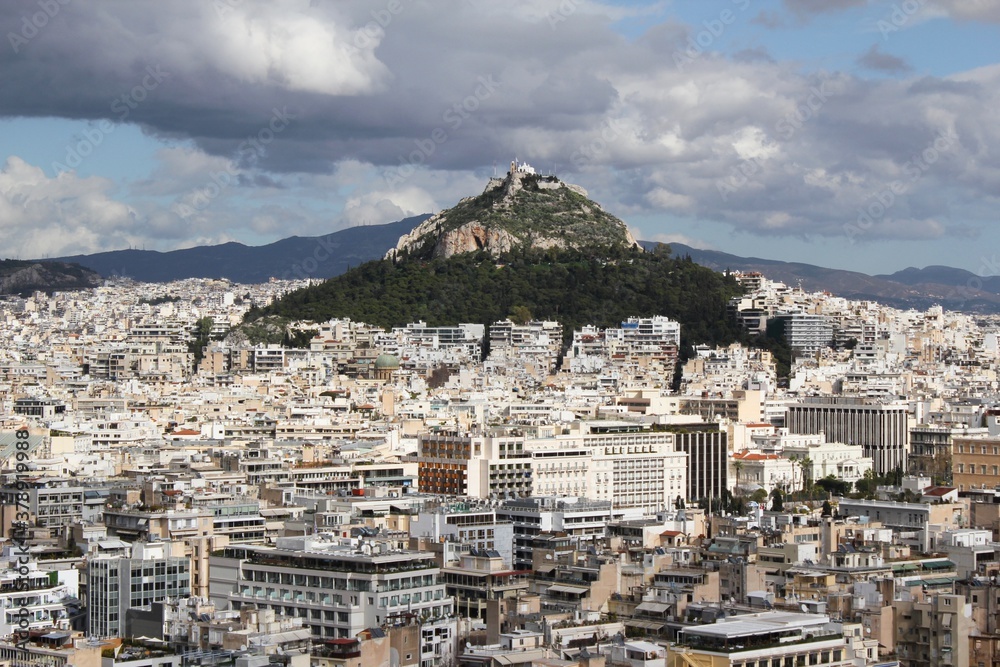 Partial view of Athens city from Acropolis hill with Lycabetus hill in the background - Athens, Greece, February 2 2020.