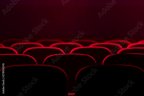 Empty cinema hall with red seats. Movie theatre