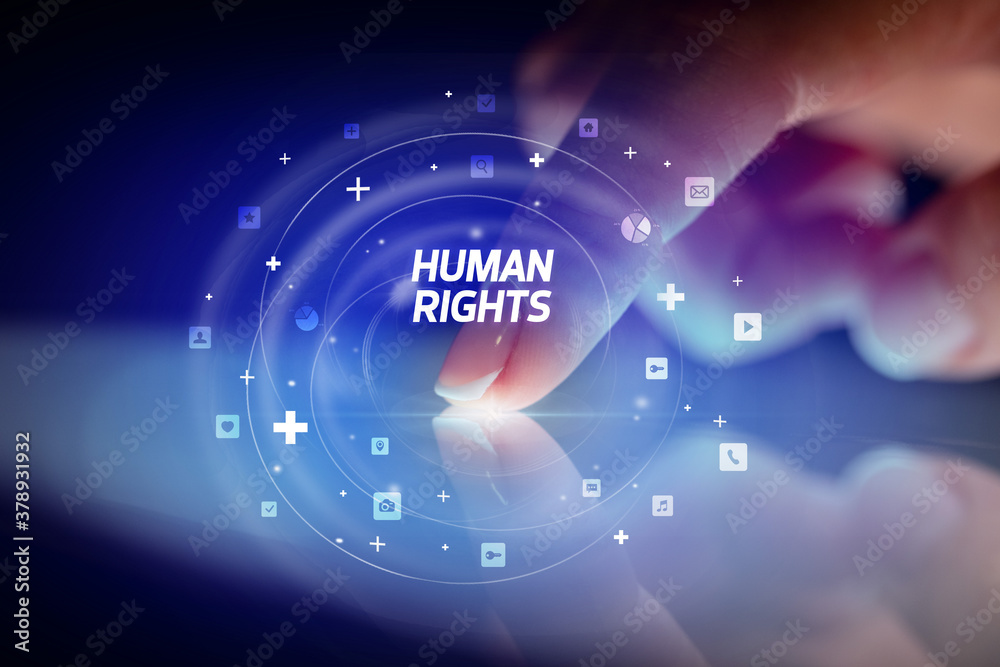 Finger touching tablet with social media icons and HUMAN RIGHTS