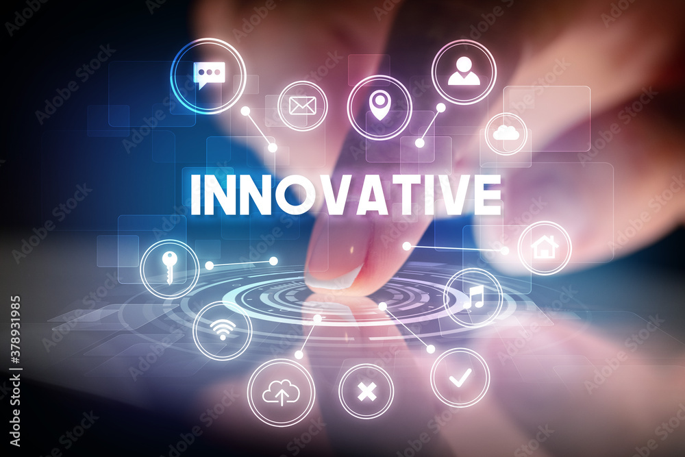 Finger touching tablet with web technology icons and INNOVATIVE inscription, web technology concept Finger touching tablet with web technology icons and INNOVATIVE inscription, web technology concept
