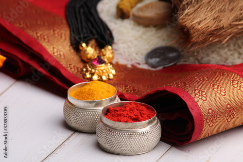 oti bharne - Indian ritual of offering a sari and a blouse piece along with coconut, haldi kumkum, bangles, mangalsutra and rice. At the time of navratri to goddes or married woman. photo