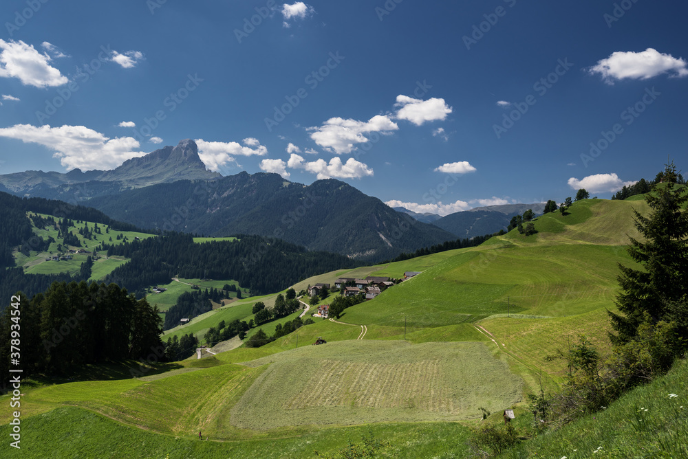 Alpine meadows and Sass de Putia/Peitlerkofel solitary mountain in the background, as seen from the hiking  trail around  La Val village, South Tirol, Italy.